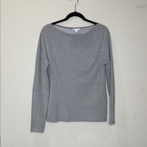 COS long-sleeve top features a unique textured design with vertical stripes